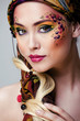 close up portrait of beauty woman with face art 