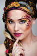 close up portrait of beauty woman with face art 