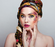 close up portrait of beauty woman with face art 