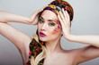 close up portrait of beauty woman with face art 