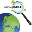 Sustainable earth looking from a magnifying glass