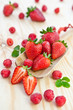 canvas print picture - Fresh strawberries on a wooden scoop