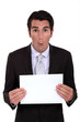 Businessman with a blank board