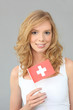 Woman with Swiss flag on gray background