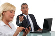 businessman and businesswoman having a discussion