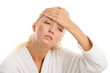 Woman touching her forehead