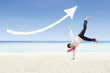 Photo: Businessman dance and increase arrow sign cloud at beach Businessman dance and increase arrow sign cloud at beach