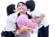 Photo: Happy mom kissed by children Happy mom kissed by children