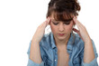 Young woman in a lot of discomfort