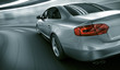 Car driving fast in tunnel
