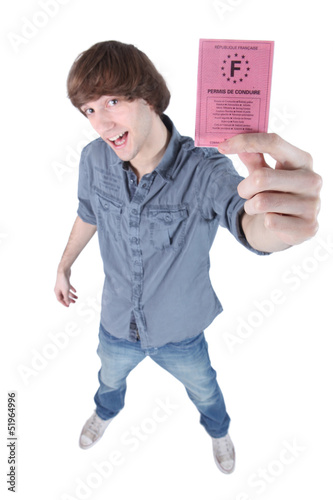Photo: Boy showing driving licence Boy showing driving licence
