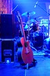 Guitar and other musical equipment on stage before concert