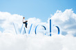 Photo: girl with a laptop sitting on the letters WEB girl with a laptop sitting on the letters WEB