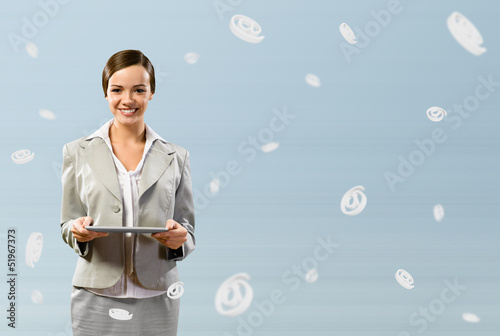 Photo: attractive business woman holding a table attractive business woman holding a table