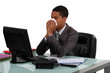 Foto: Businessman blowing his nose Businessman blowing his nose