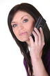 Photo: Woman talking on her mobile phone Woman talking on her mobile phone