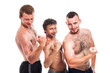 Shirtless sportsmen posing