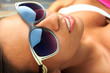 Photo: Pretty young woman relaxed by the pool Pretty young woman relaxed by the pool
