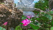 Buddha and lotus on blue sky background