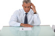 Photo: Confused businessman reading document Confused businessman reading document