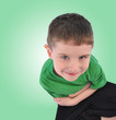 Foto: Happy Boy Looking Up on Green Background Happy Boy Looking Up on Green Background