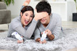 Playful couple with video games