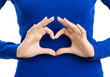 Foto: Woman showing heart symbol gesture, isolated Woman showing heart symbol gesture, isolated