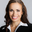 Happy smiling young businesswoman, on gray