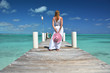 Girl on the wooden jetty. Exuma, Bahamas