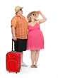 Happy obese couple going to vacations.