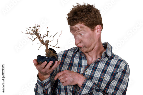 Photo: Electrocuted man holding a plant Electrocuted man holding a plant