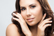 Photo: Portrait of beautiful woman, over grey Portrait of beautiful woman, over grey