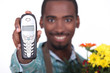 Florist holding telephone