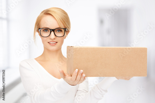 Photo: attractive businesswoman with cardboard box attractive businesswoman with cardboard box