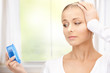 woman holding alarm clock