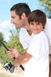 Photo: Man and little boy fishing Man and little boy fishing