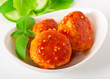 meatballs in tomato sauce, decorated with leaves of basil