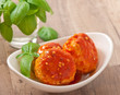 meatballs in tomato sauce, decorated with leaves of basil
