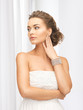 woman with pearl earrings and bracelet