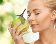 woman smelling apple