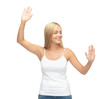 woman in white t-shirt pressing imaginary button