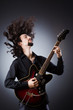 Man playing guitar during concert