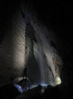 Hiker in a cave, Pissai waterfall, grotta Rio Martino, Italy