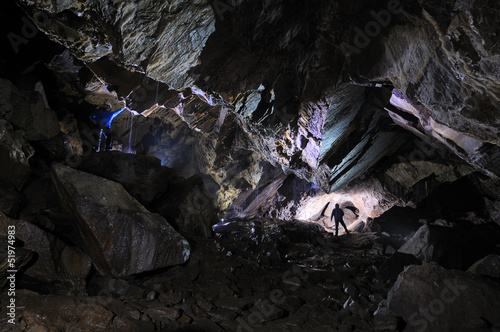Photo: 2 Caver in a cave, Pugnetto, Mezzenile, Piedmont, Italy 2 Caver in a cave, Pugnetto, Mezzenile, Piedmont, Italy