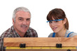 Foto: Carpenter working with his daughter Carpenter working with his daughter