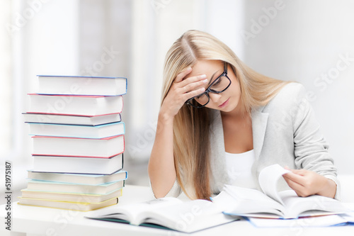 Photo: student with books and notes student with books and notes