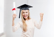 student in graduation cap with certificate