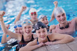 Photo: happy teen group at swimming pool happy teen group at swimming pool