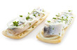 Sandwiches with herring, onions and herbs, isolated