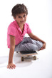 Photo: Little boy sat on skateboard Little boy sat on skateboard